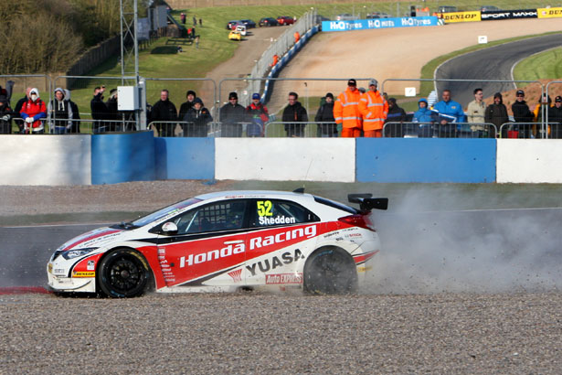 Gordon Shedden is pushed into the gravel trap on the last lap