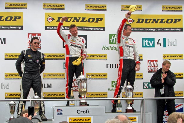 Gordon Shedden on the podium with Rob Austin (left) and Matt Neal (right)