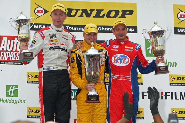 Matt Neal, Dave Newsham, and Jeff Smith celebrate after race 3