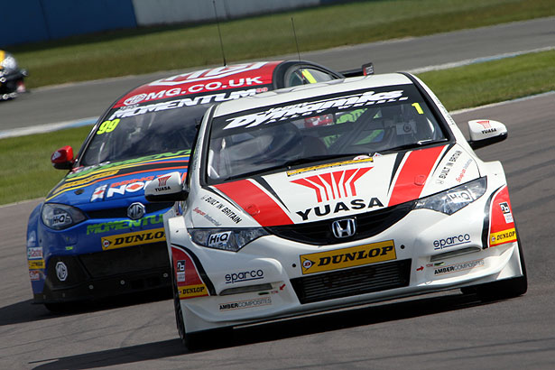 Championship leader Matt Neal being chased by Jason Plato