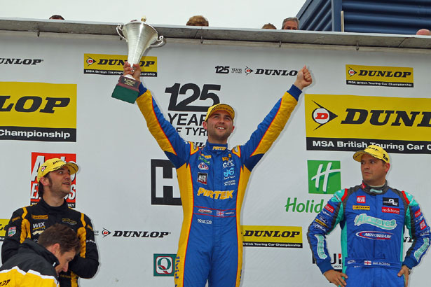 Andrew Jordan celebrates winning the first race of the day