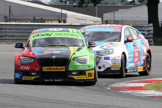 Colin Turkington under pressure from Jason Plato