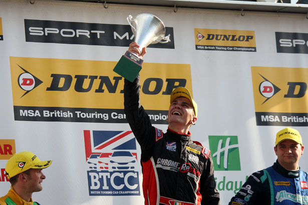 Aron Smith lifts the winner's trophy for race 3