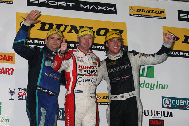 Gordon Shedden on the podium with Jack Clarke (right) and Mat Jackson (left)