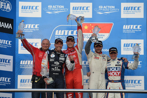 Rob Huff (centre) on the podium after race 2 from Beijing