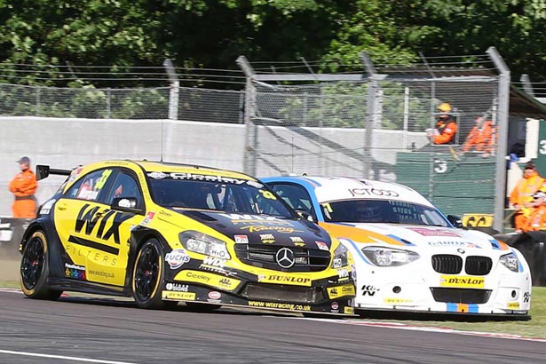 Adam Morgan and Sam Tordoff battle on the first lap of the race