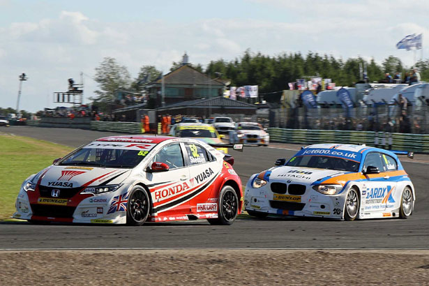 Gordon Shedden defending the lead from Rob Collard