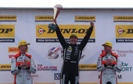 Tom Ingram on the podium with Matt Neal and Gordon Shedden