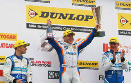 Rob Collard celebrates his victory on the podium at Croft