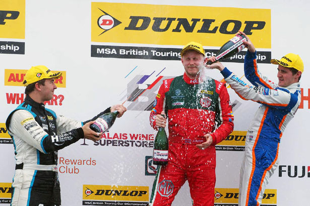 Tom Ingram and Sam Tordoff 'help' Ashley Sutton celebrate his maiden BTCC victory