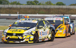 Aron Smith defending the lead from Gordon Shedden and Colin Turkington