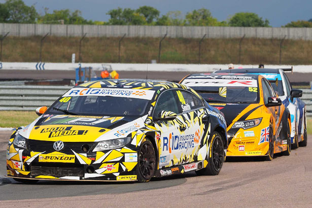 Aron Smith defending the lead from Gordon Shedden and Colin Turkington