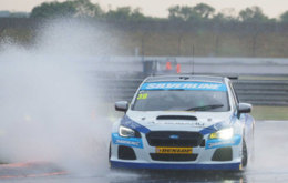 Warren Scott discovering just how wet it was at Rockingham!