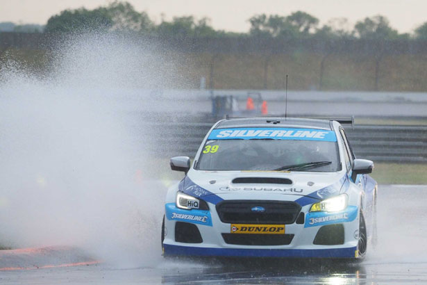 Warren Scott discovering just how wet it was at Rockingham!