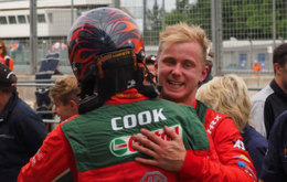 Race winner Ashley Sutton celebrates with team-mate Josh Cook