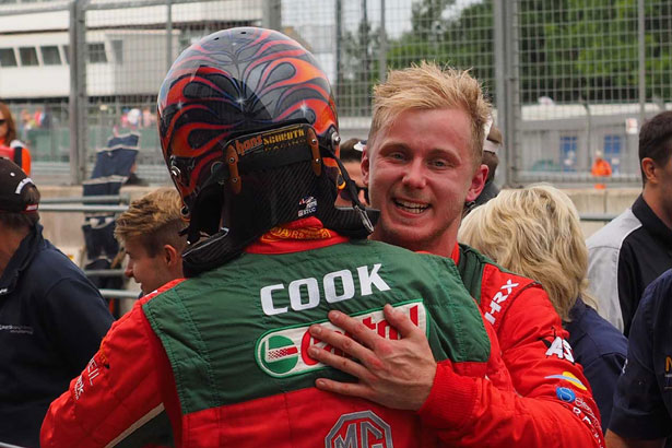Race winner Ashley Sutton celebrates with team-mate Josh Cook